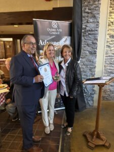 Connie Carson (right) earning her Arts Recognition Award